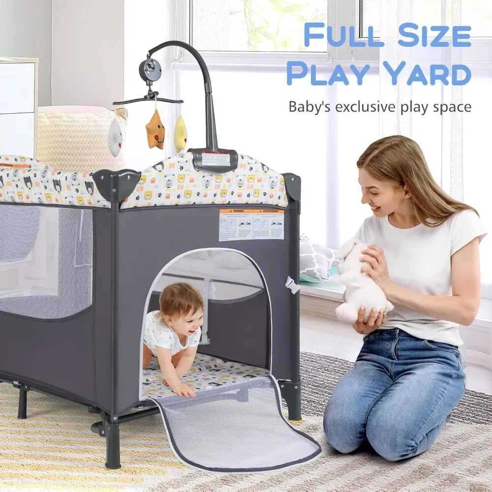 5 in 1 Pack and Play Baby Bedside Sleeper Crib - Portable Baby Crib with Mattress, Bassinet, Diaper Changer, Storage Rack and Music Box Hanging Toy.